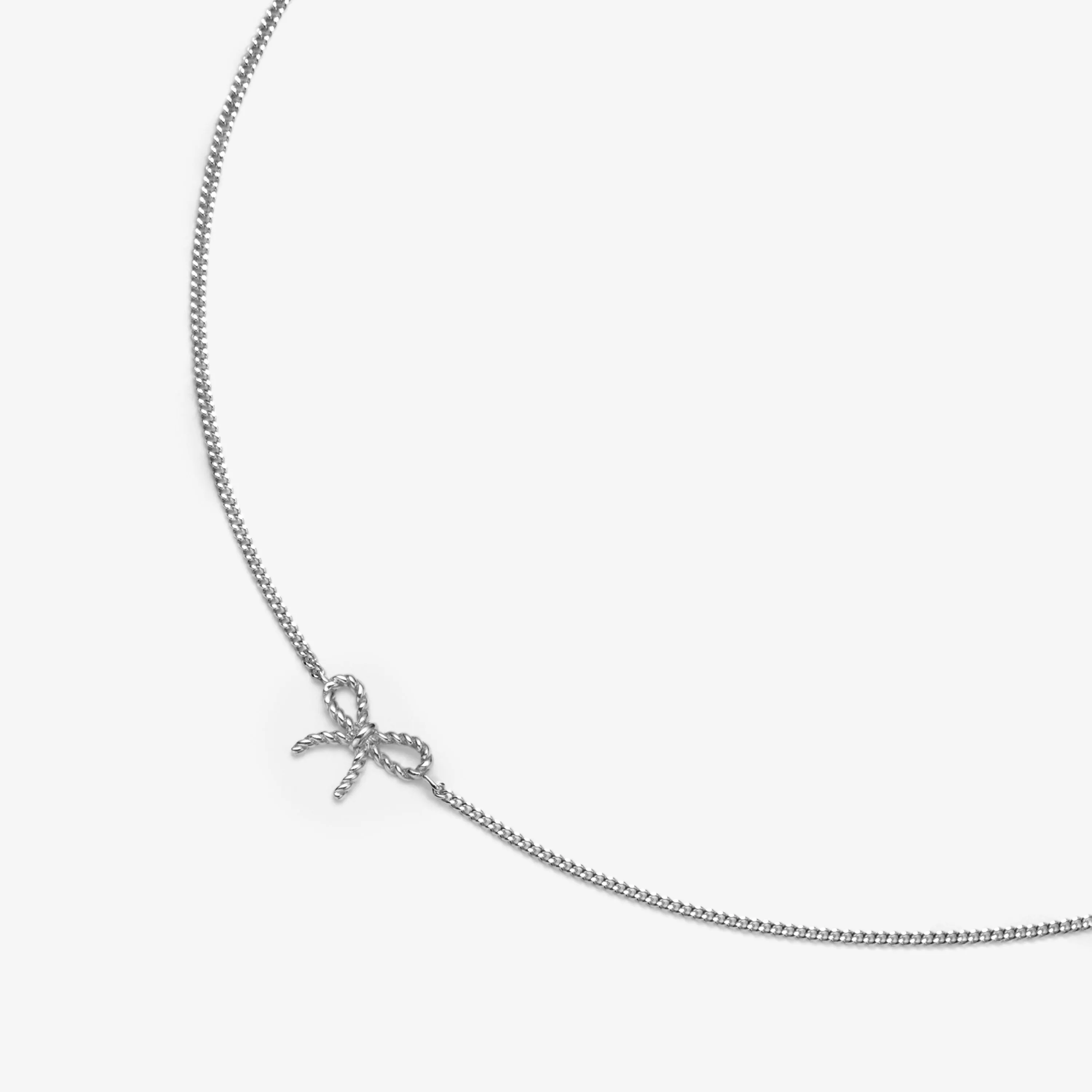 Asher micro bow bracelet sold by Adornmonde