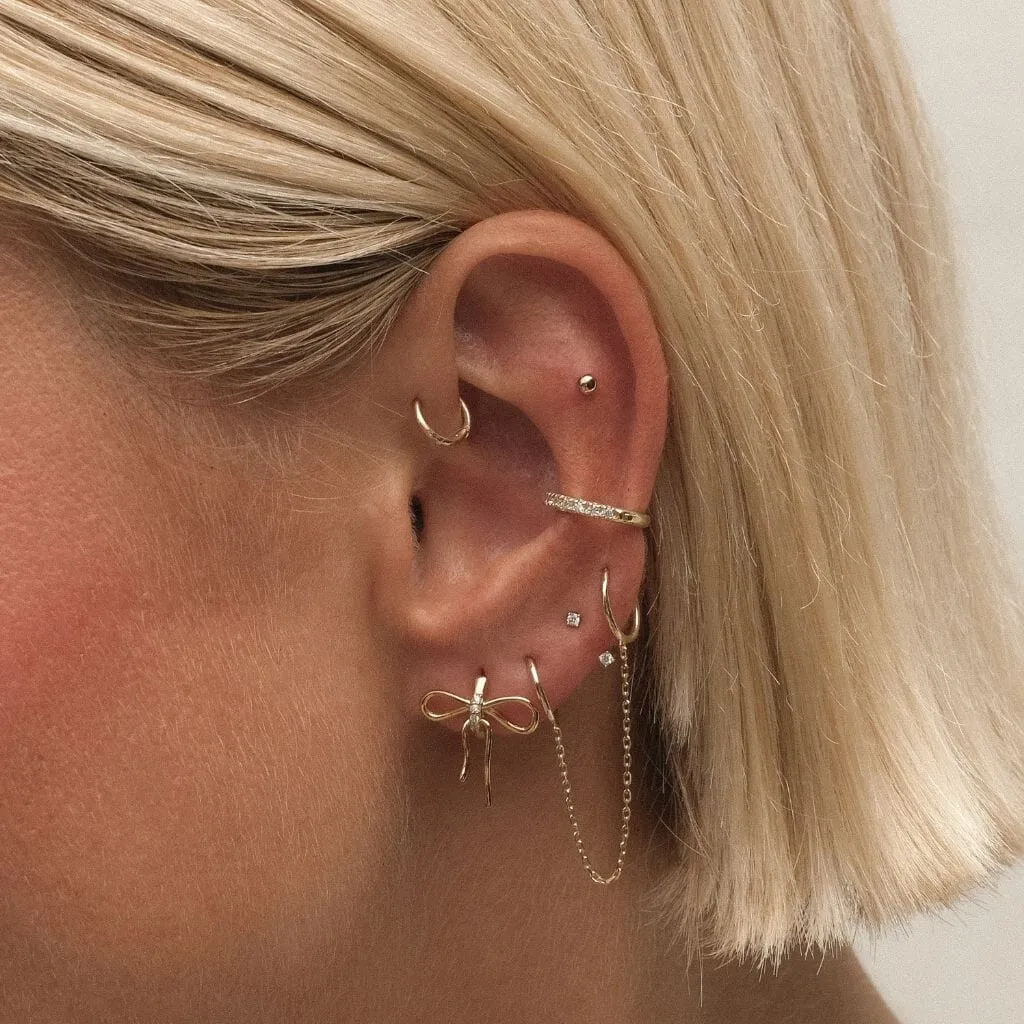 Cliff bow huggie earrings sold by Adornmonde product image thumbnail 2