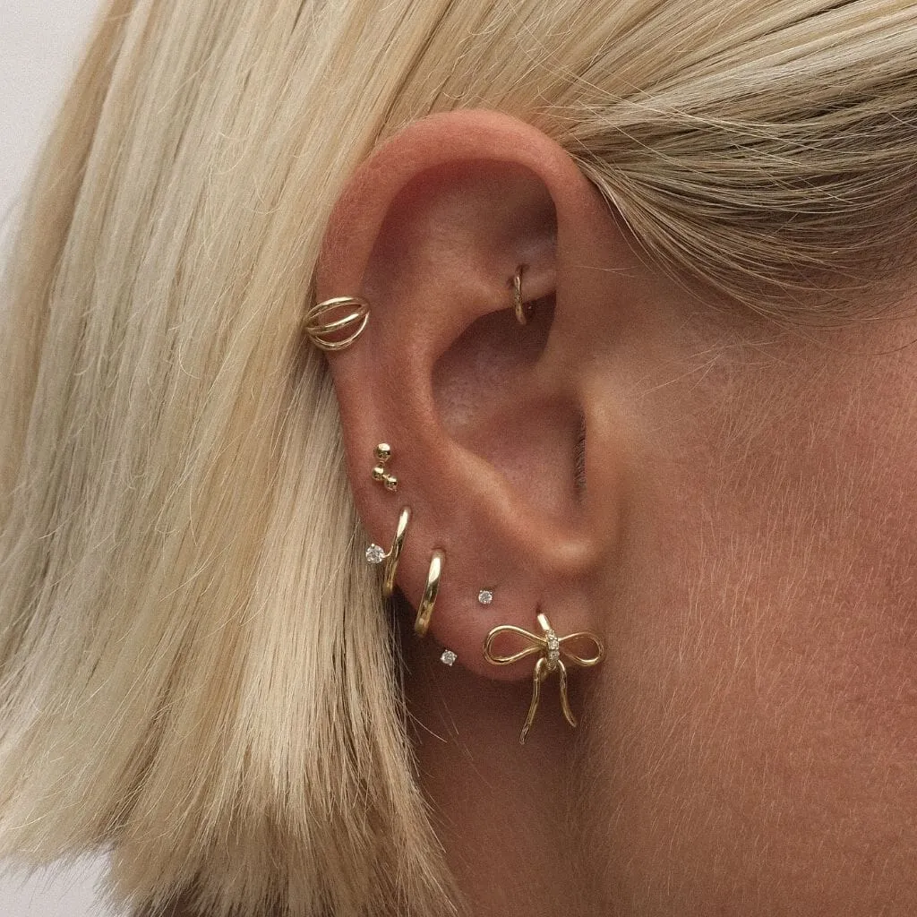 Cliff bow huggie earrings sold by Adornmonde product image thumbnail 3