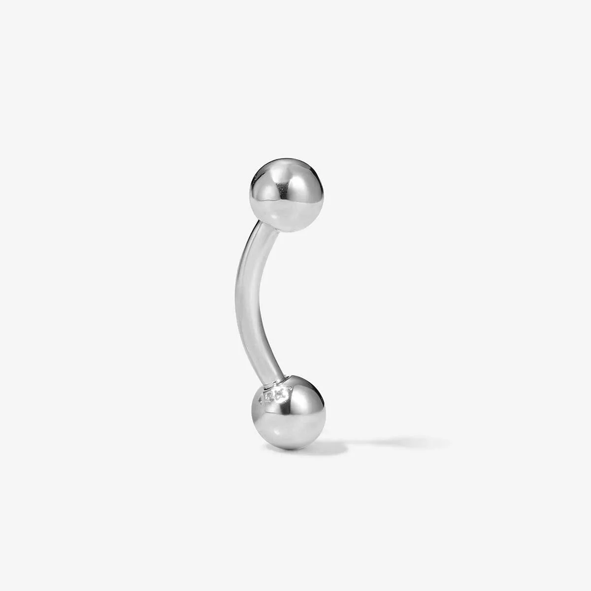 Mitchel barbell piercing sold by Adornmonde