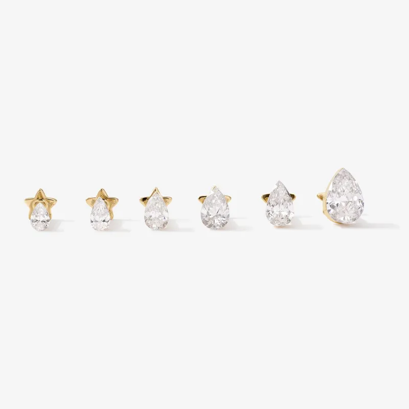 Hugh pear diamond piercing sold by Adornmonde