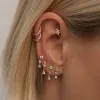 Madeus huggie earrings sold by Adornmonde