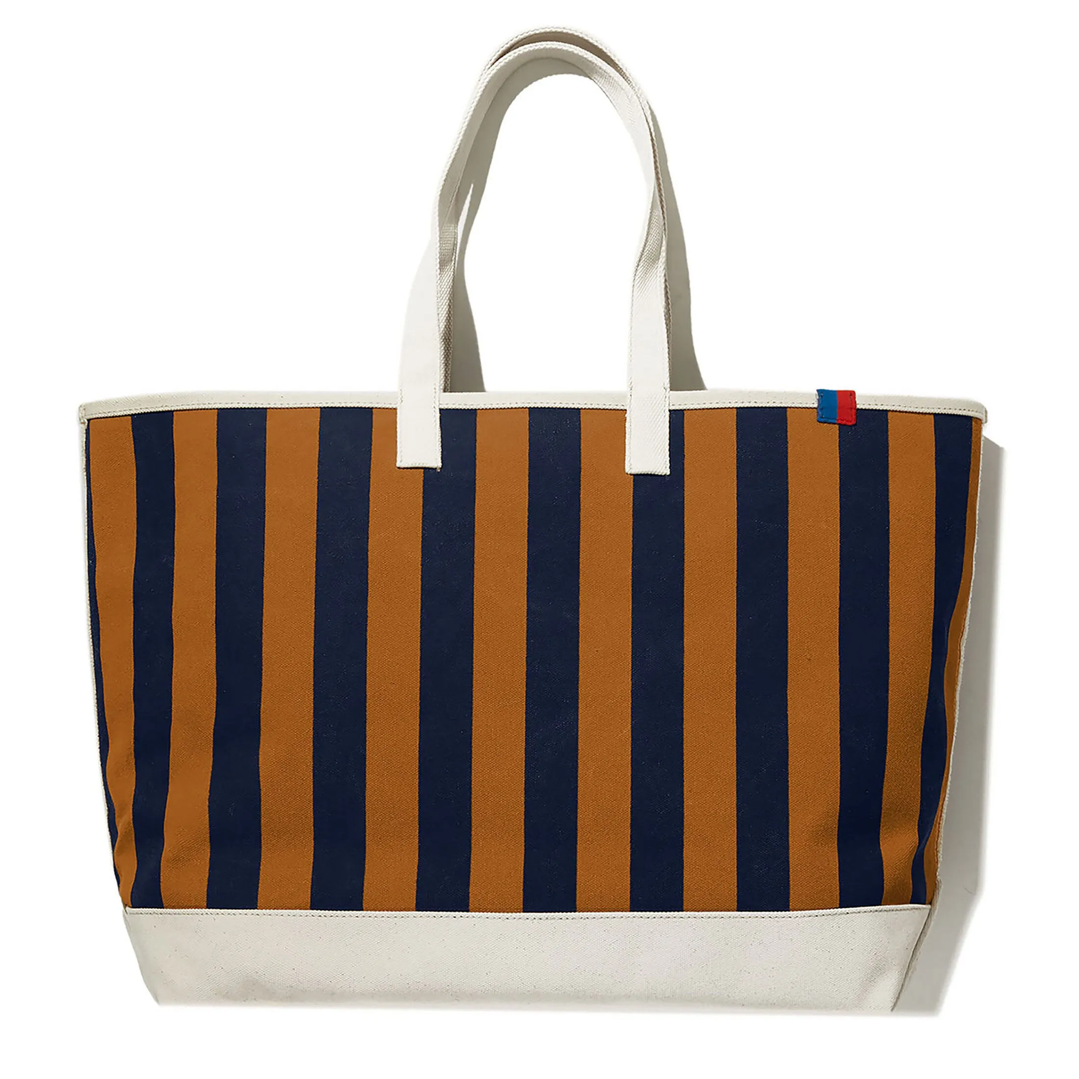 The Over the Shoulder All Over Striped Tote - Vicuna/Navy sold by Kule