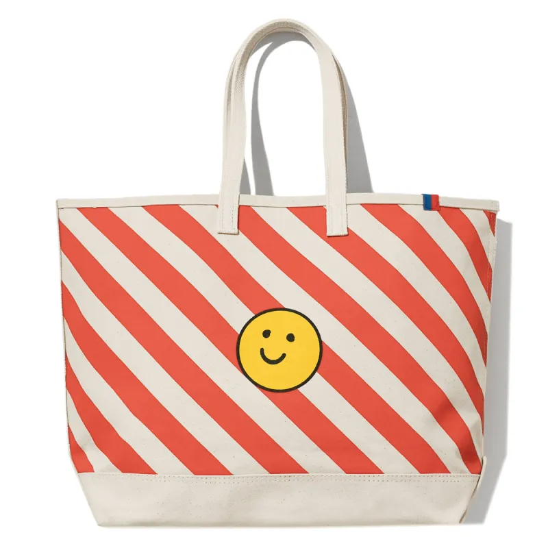 The Over the Shoulder Diagonal Striped Smile Tote - Canvas/Poppy sold by Kule