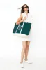 The Over the Shoulder Tennis Tote - Green sold by Kule