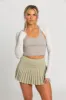 Pale Moss Pleated Tennis Skirt sold by Gold Hinge