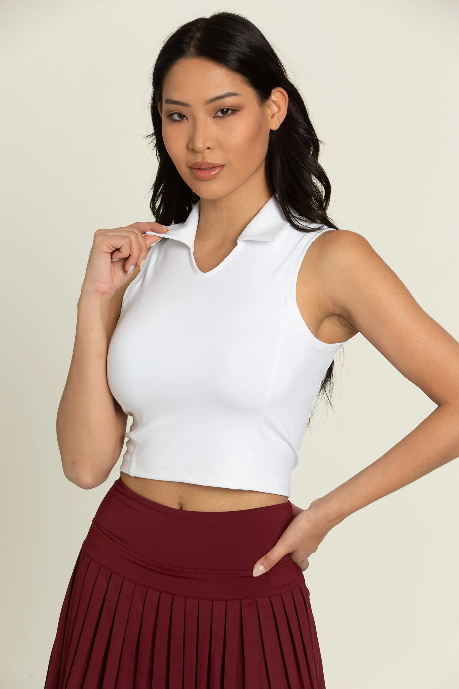 Ivory V-Neck Sleeveless Polo Top sold by Gold Hinge