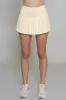Butter Yellow Pleated Tennis Skirt sold by Gold Hinge