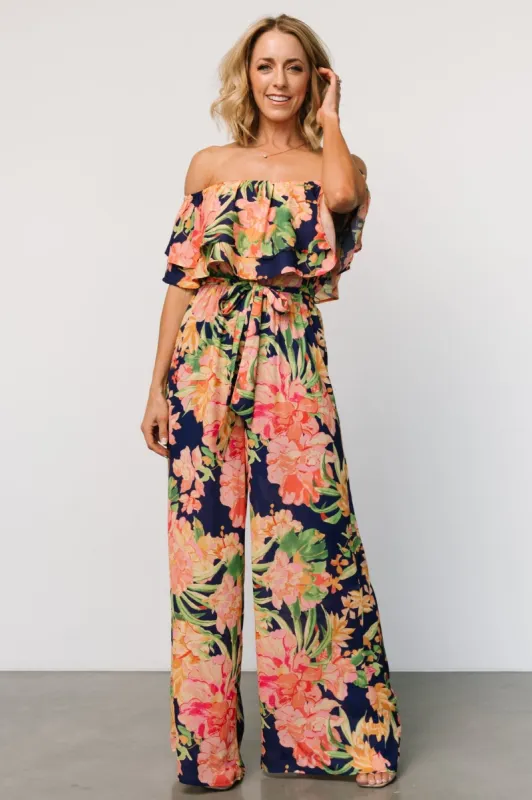 Capistrano Ruffle Jumpsuit | Navy Floral sold by Baltic Born