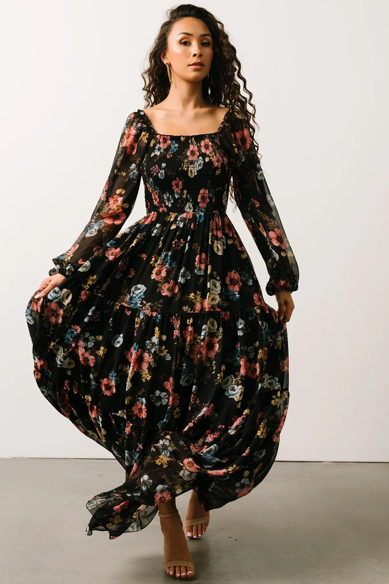 Isabela Smocked Maxi Dress | Black Multi Floral sold by Baltic Born
