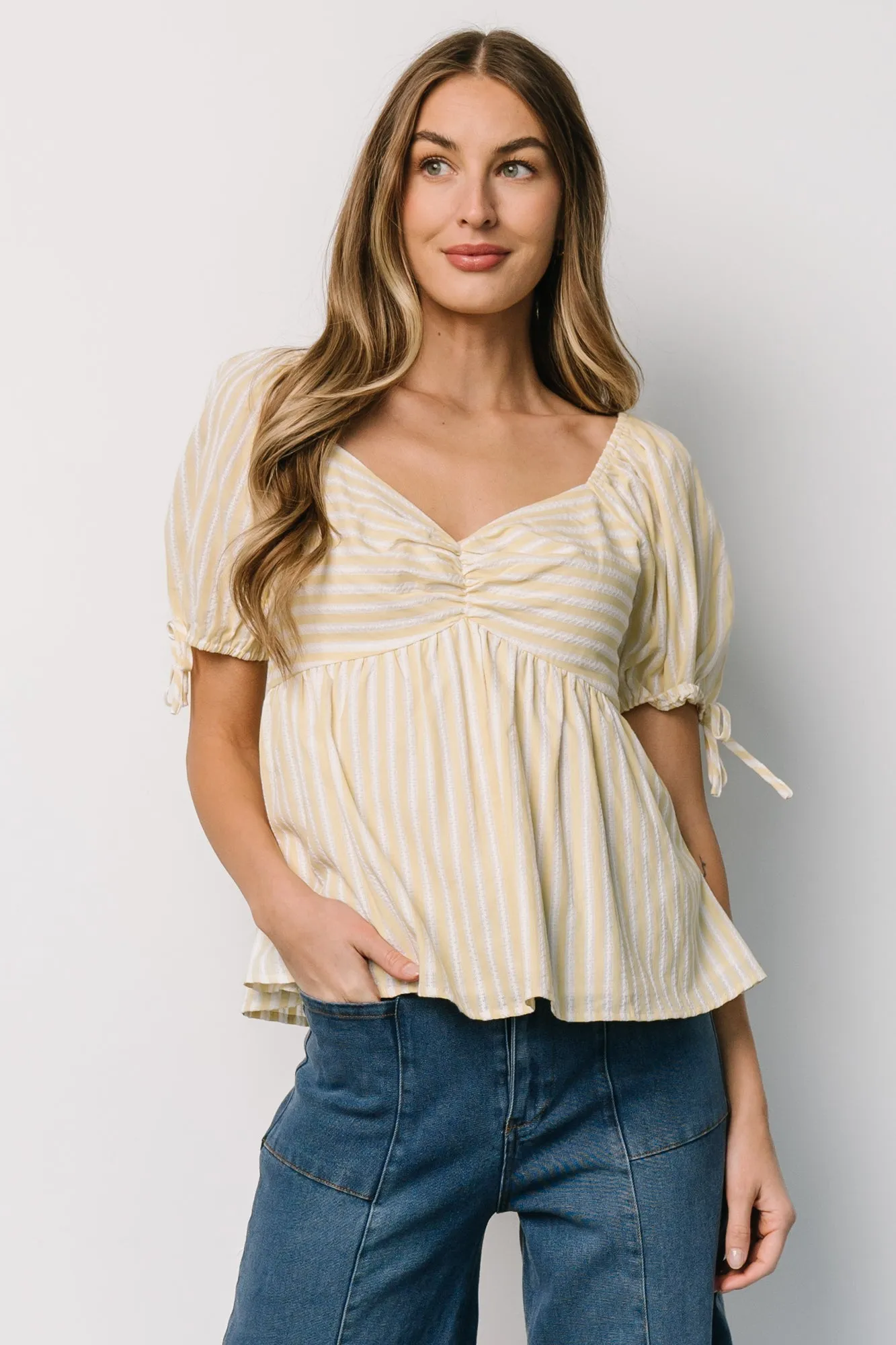 Betsy Peplum Top | Yellow + White Stripe sold by Baltic Born