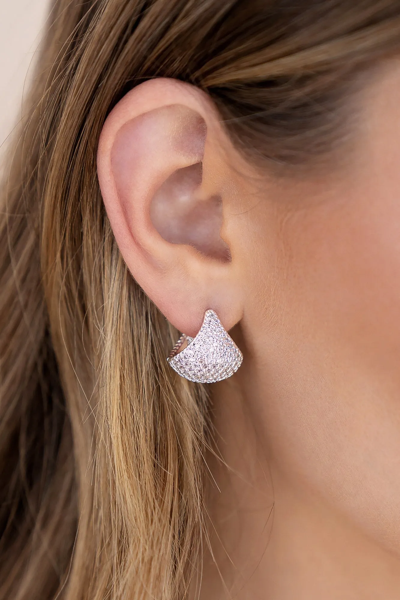 Pavé Encrusted Huggie Hoops sold by Baltic Born