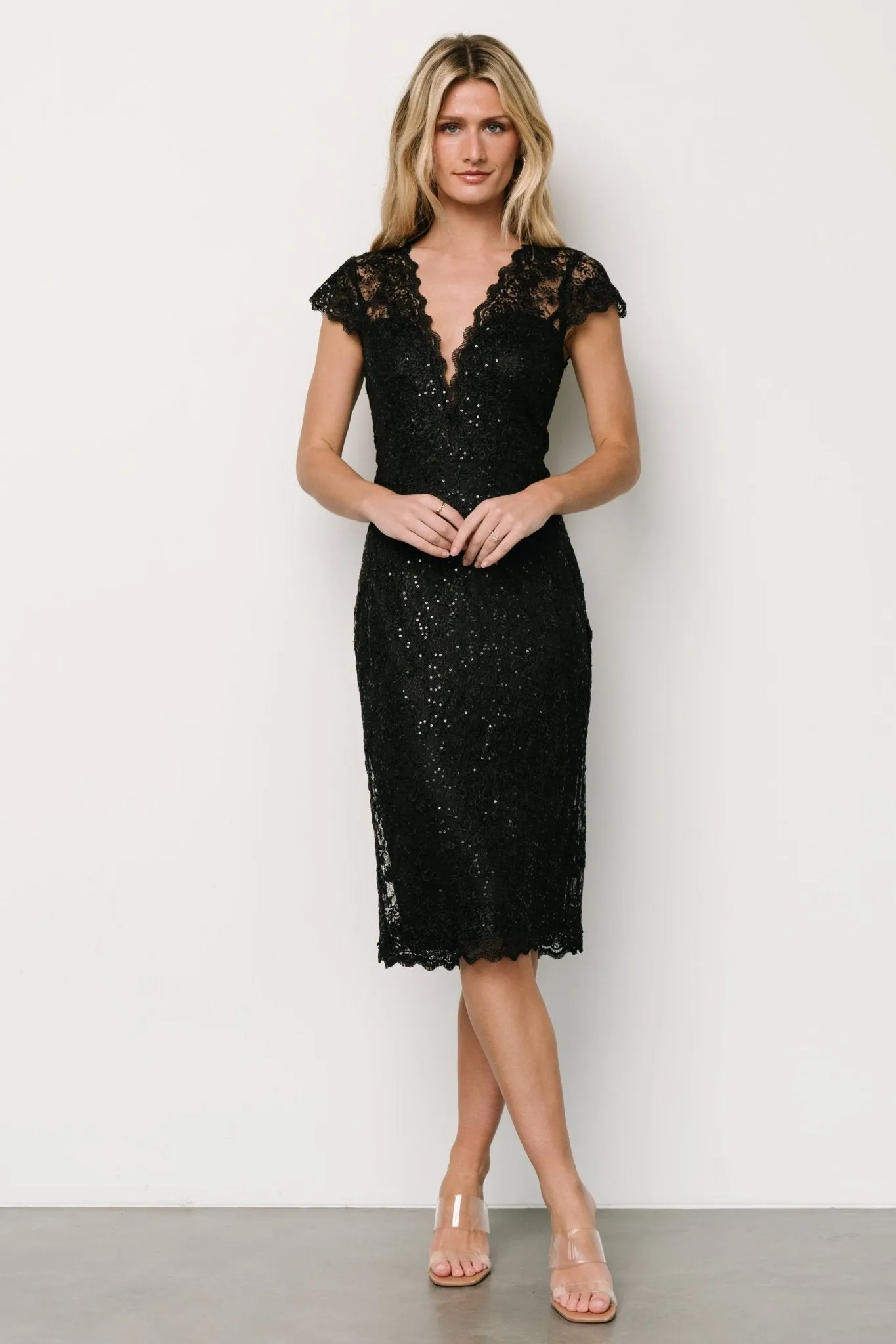 Oriana Embossed Shimmer Midi Dress | Black sold by Baltic Born