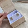 Shield Letter Huggie Hoops sold by Baby Gold