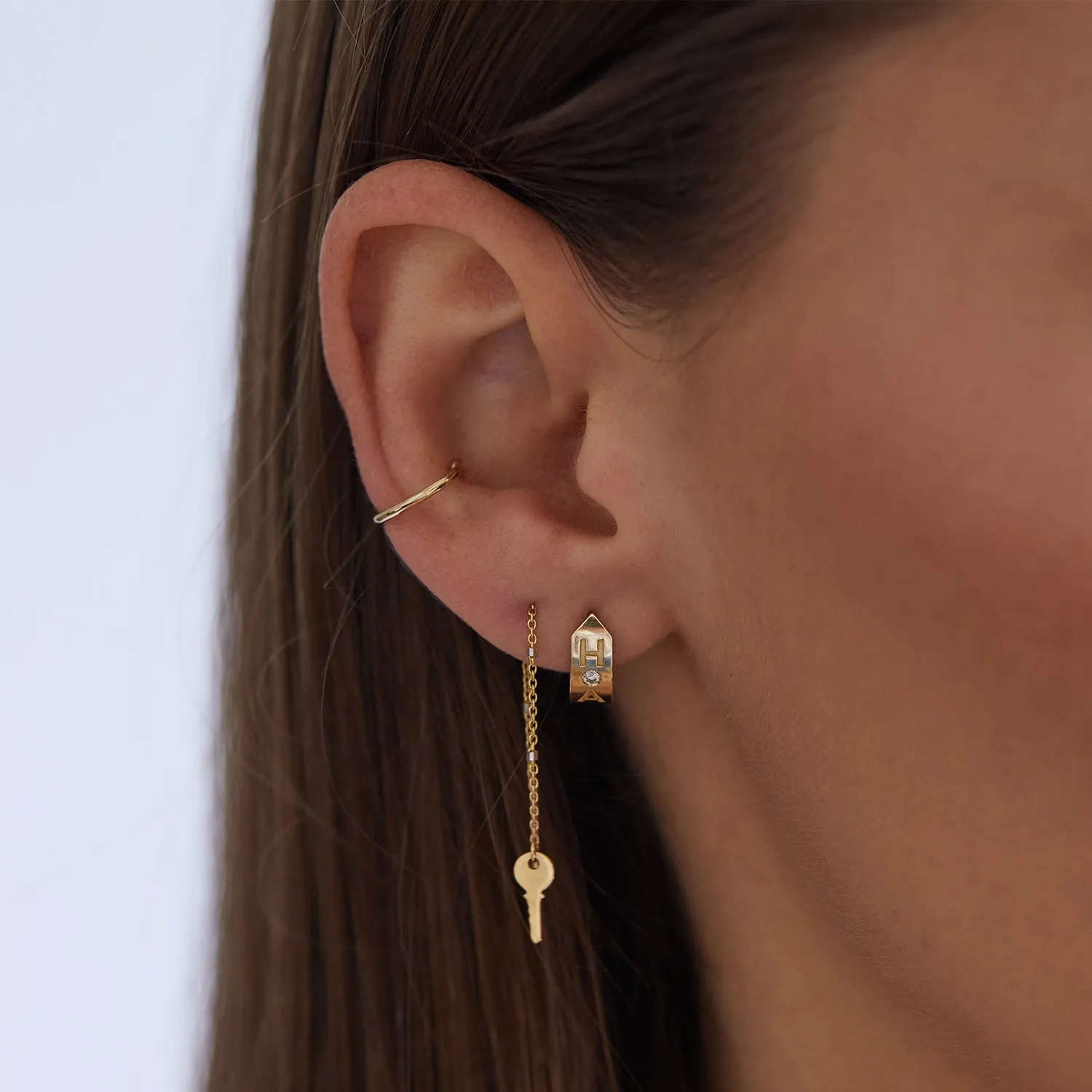 Shield Letter Huggie Hoops sold by Baby Gold product image thumbnail 5