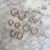 Linea Tapered Hoop Earrings sold by Baby Gold