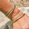 Turquoise & Faceted Gold Stretch Bead Bracelet sold by Baby Gold