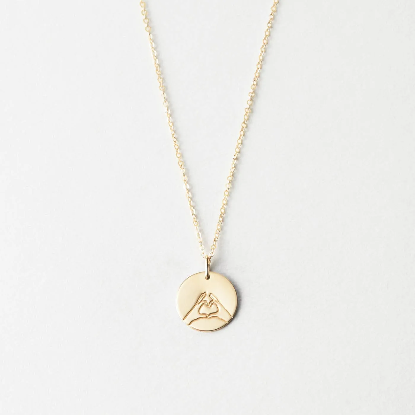 Hand Heart Necklace sold by GLDN