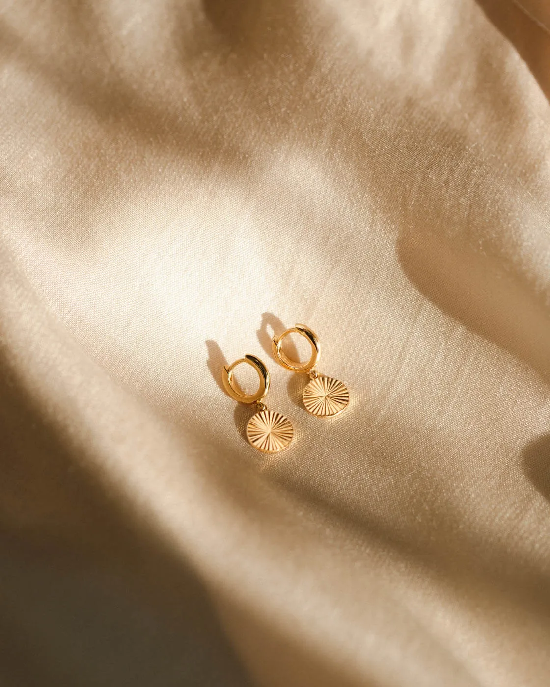 Radiant Charm Huggie Hoops sold by GLDN product image thumbnail 4