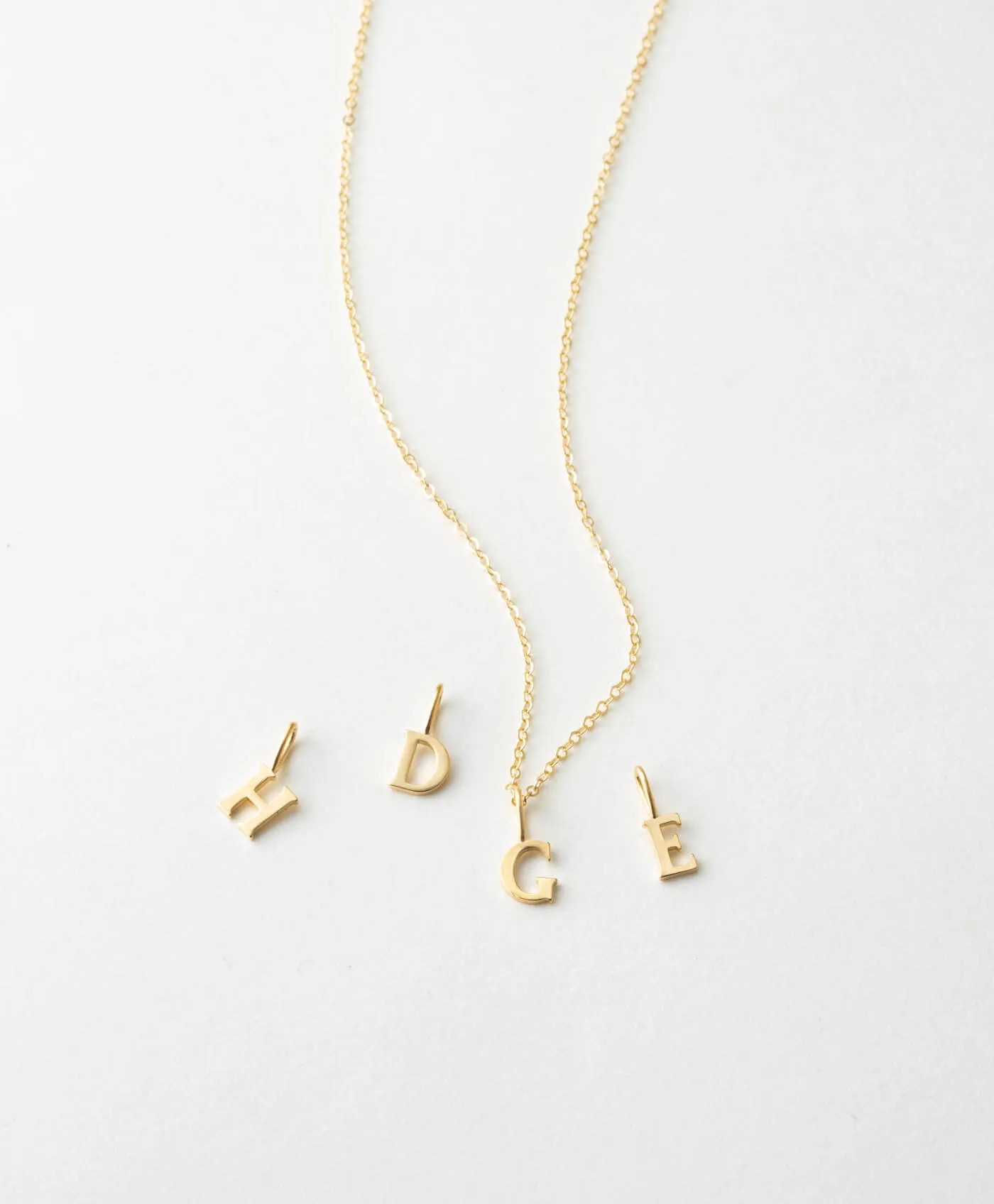 Dainty Serif Initial Necklace sold by GLDN
