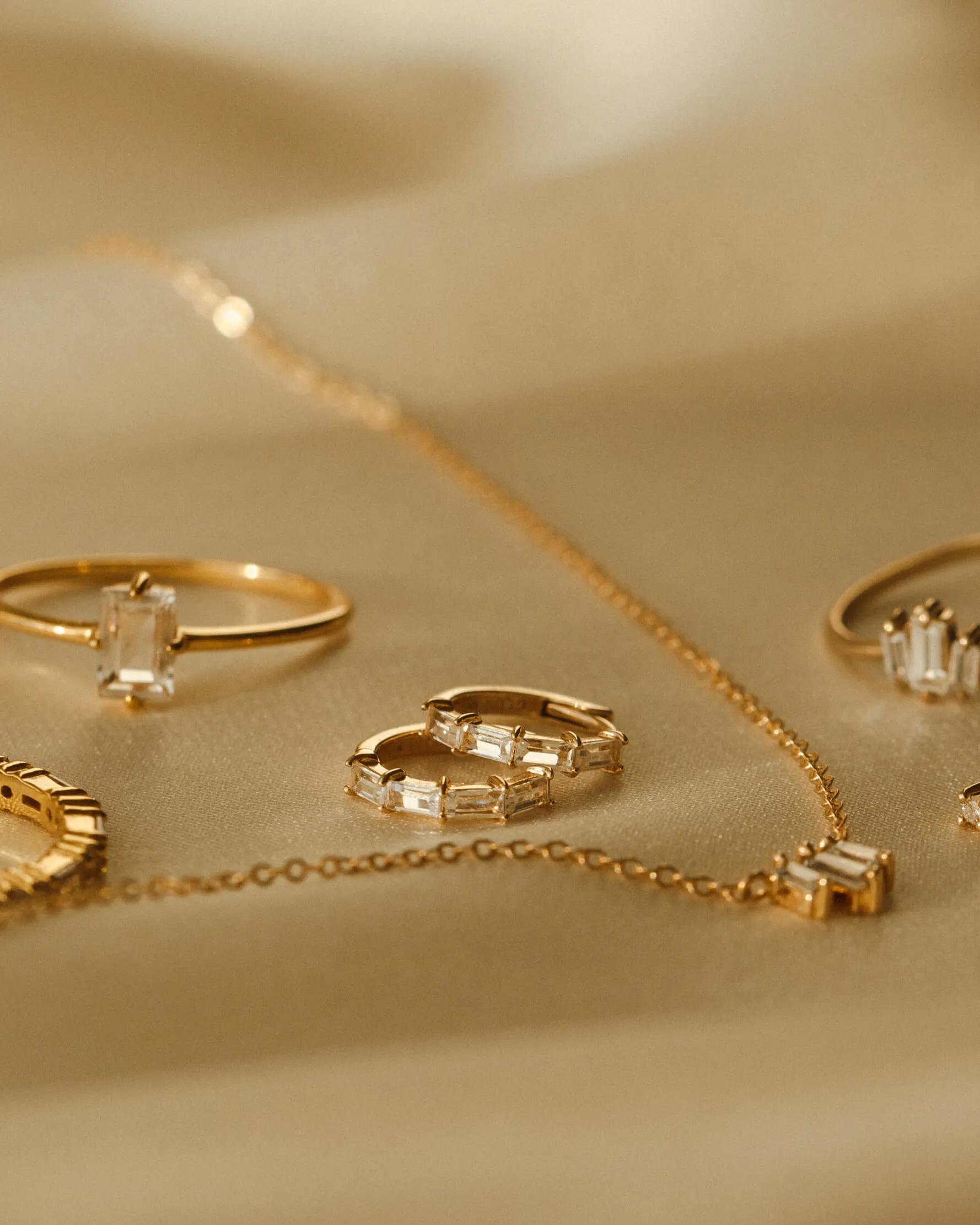 Nouveau White Sapphire Huggie Hoops sold by GLDN product image thumbnail 5