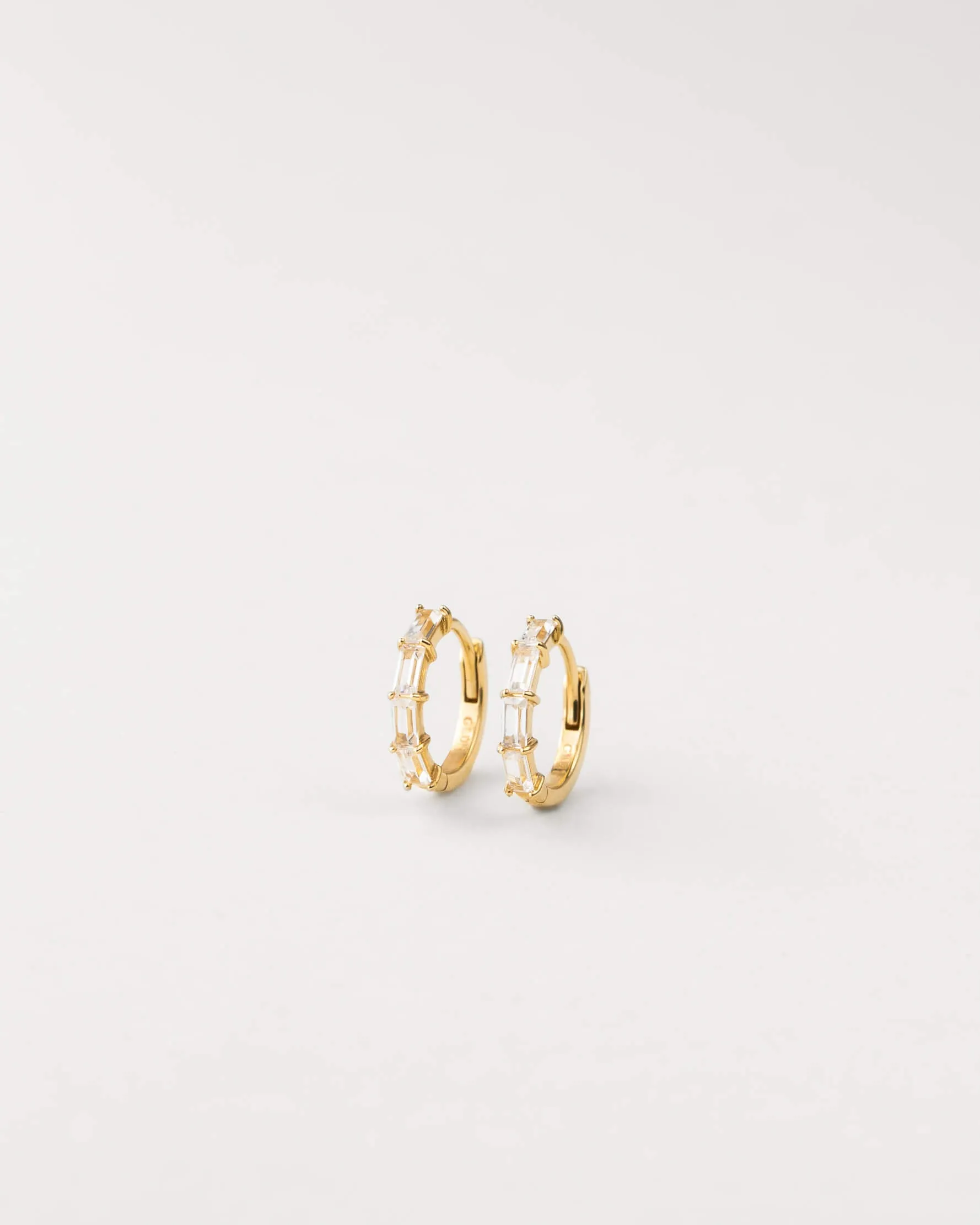 Nouveau White Sapphire Huggie Hoops sold by GLDN product image thumbnail 3