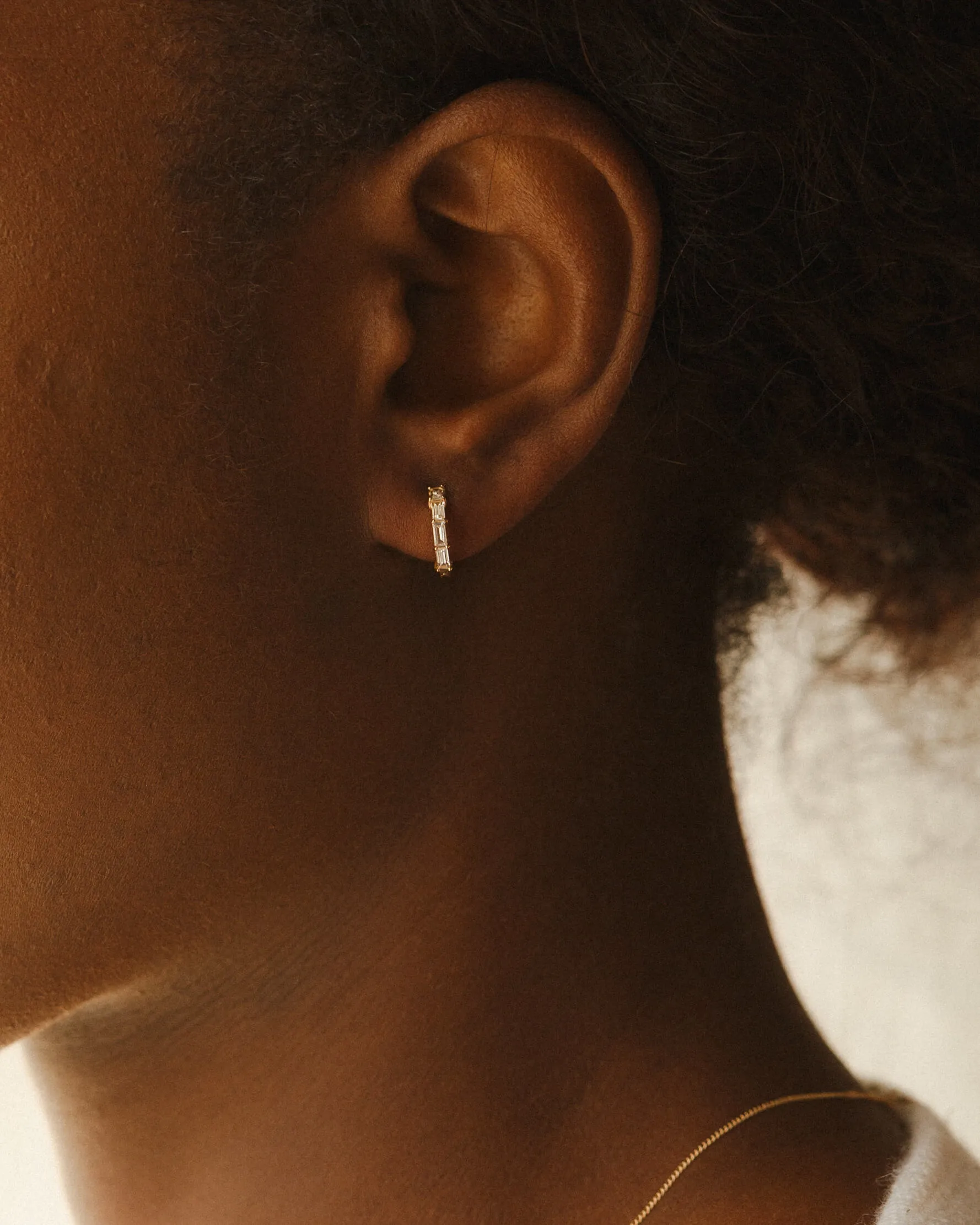 Nouveau White Sapphire Huggie Hoops sold by GLDN product image thumbnail 2