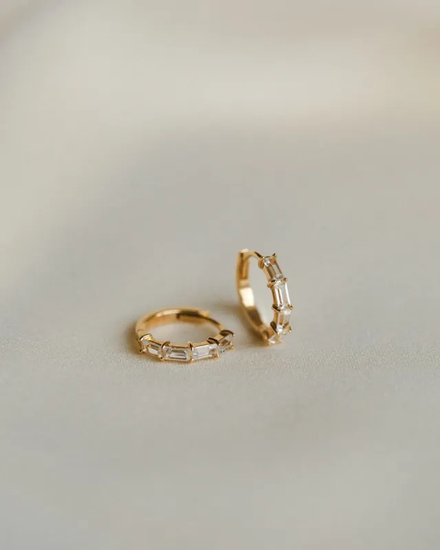 Nouveau White Sapphire Huggie Hoops sold by GLDN