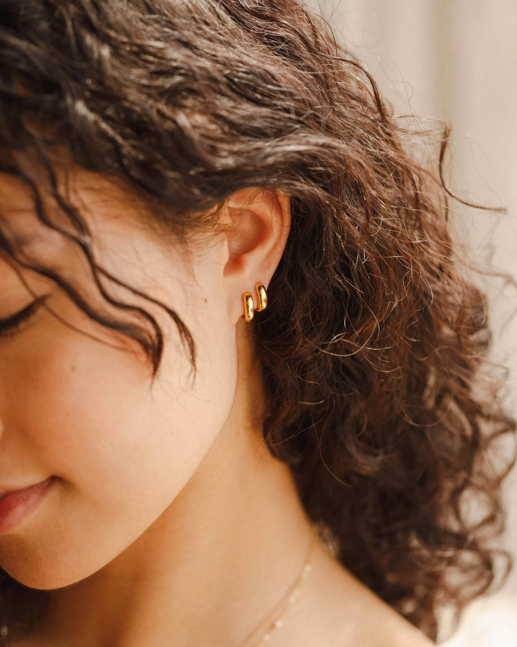 Domed Huggie Hoops sold by GLDN