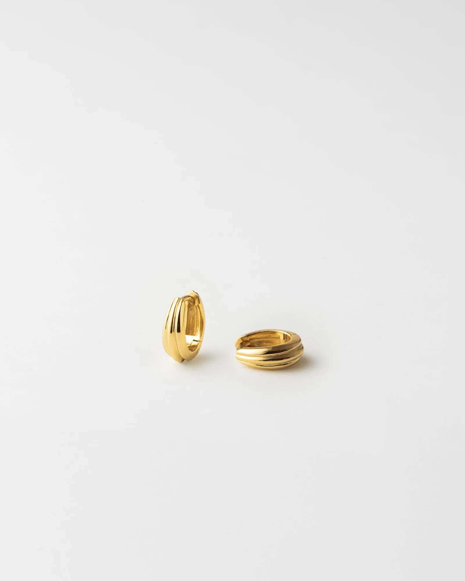 Fluted Huggie Hoops sold by GLDN