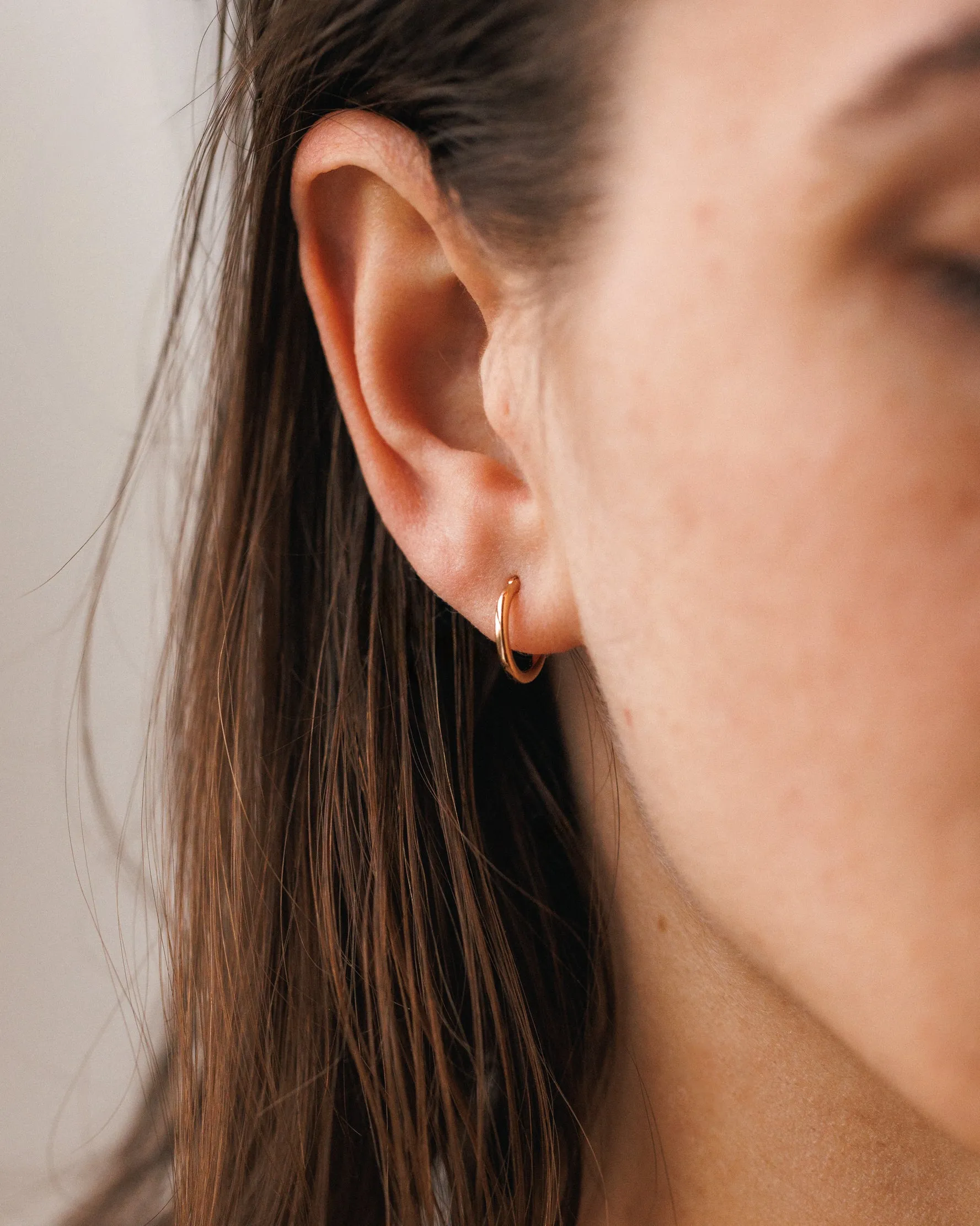 Solid Gold 24/7 Huggie Hoops sold by GLDN product image thumbnail 2