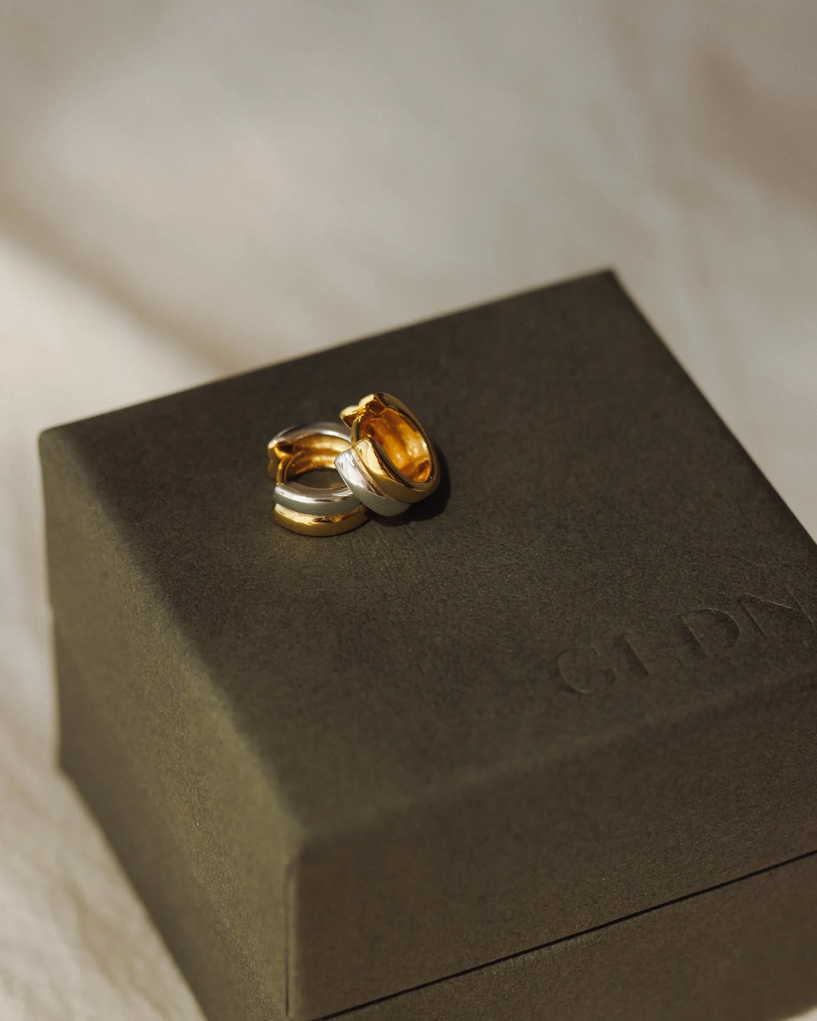 Double Take Huggie Hoops sold by GLDN product image thumbnail 4