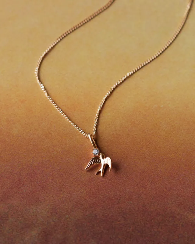 Solid Gold Swallow Charm sold by GLDN