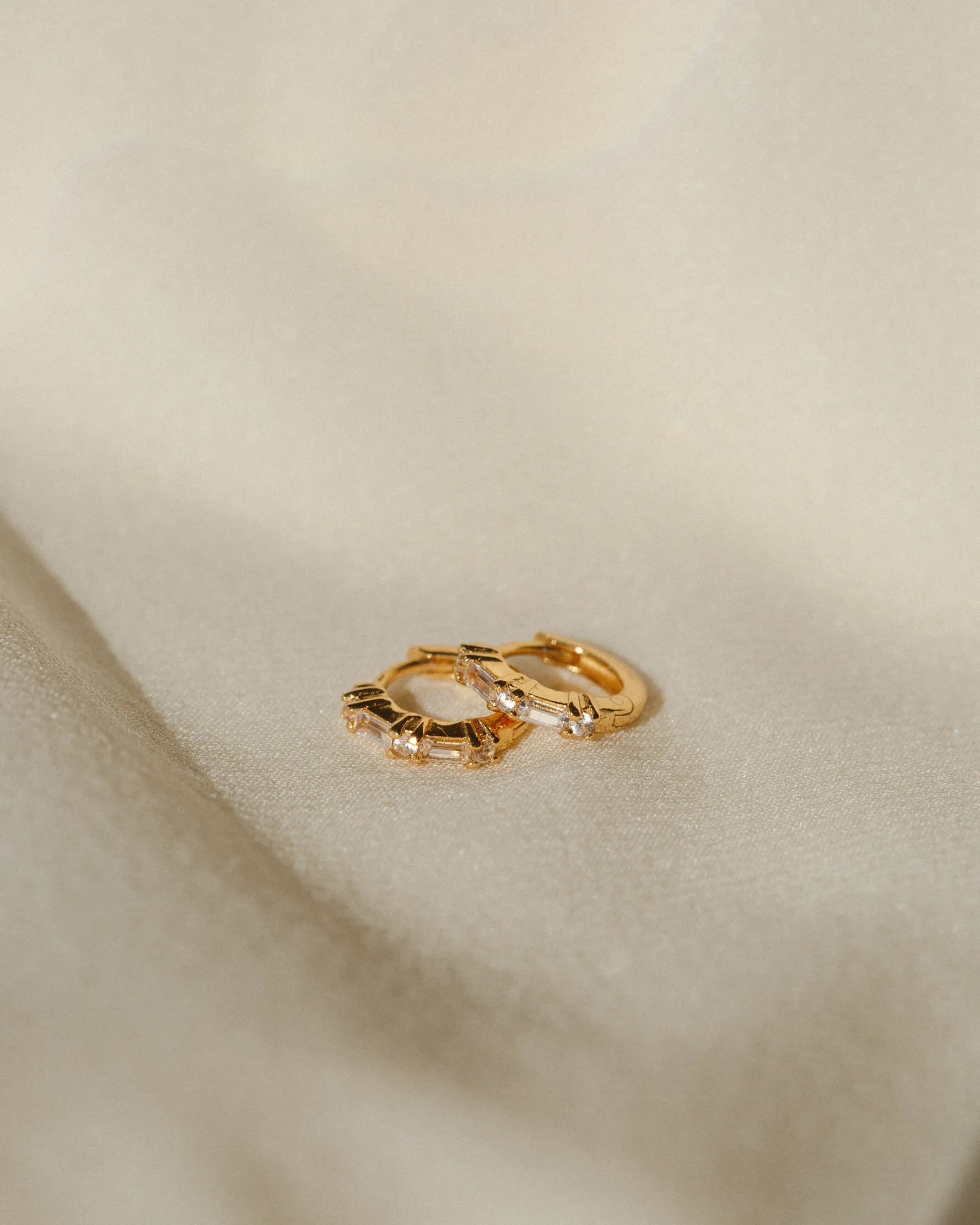 Grace White Sapphire Huggie Hoops sold by GLDN product image thumbnail 2