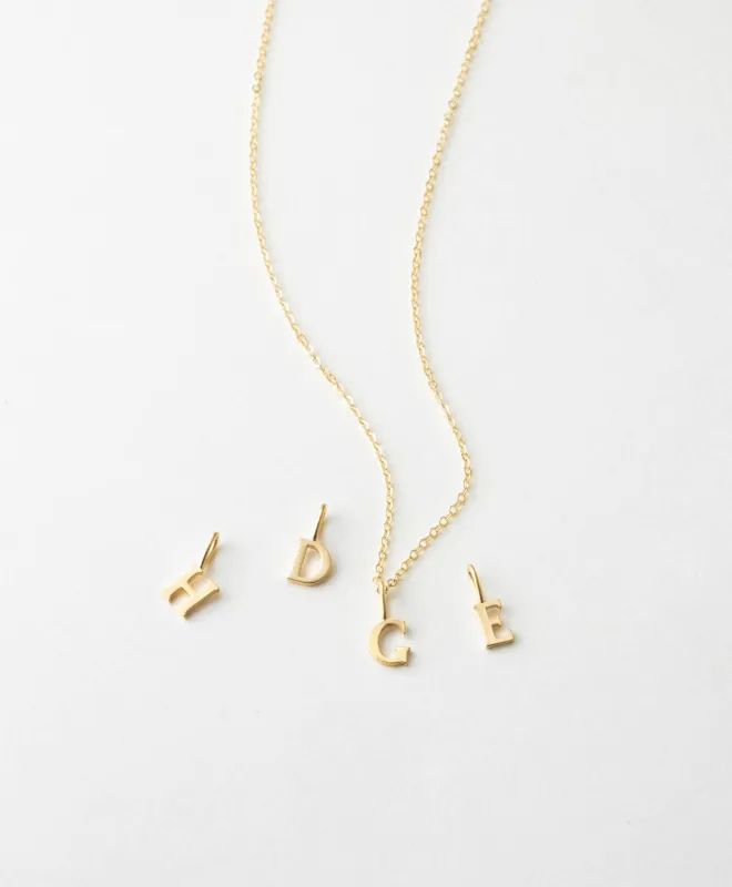 14k Dainty Serif Initial Necklace sold by GLDN