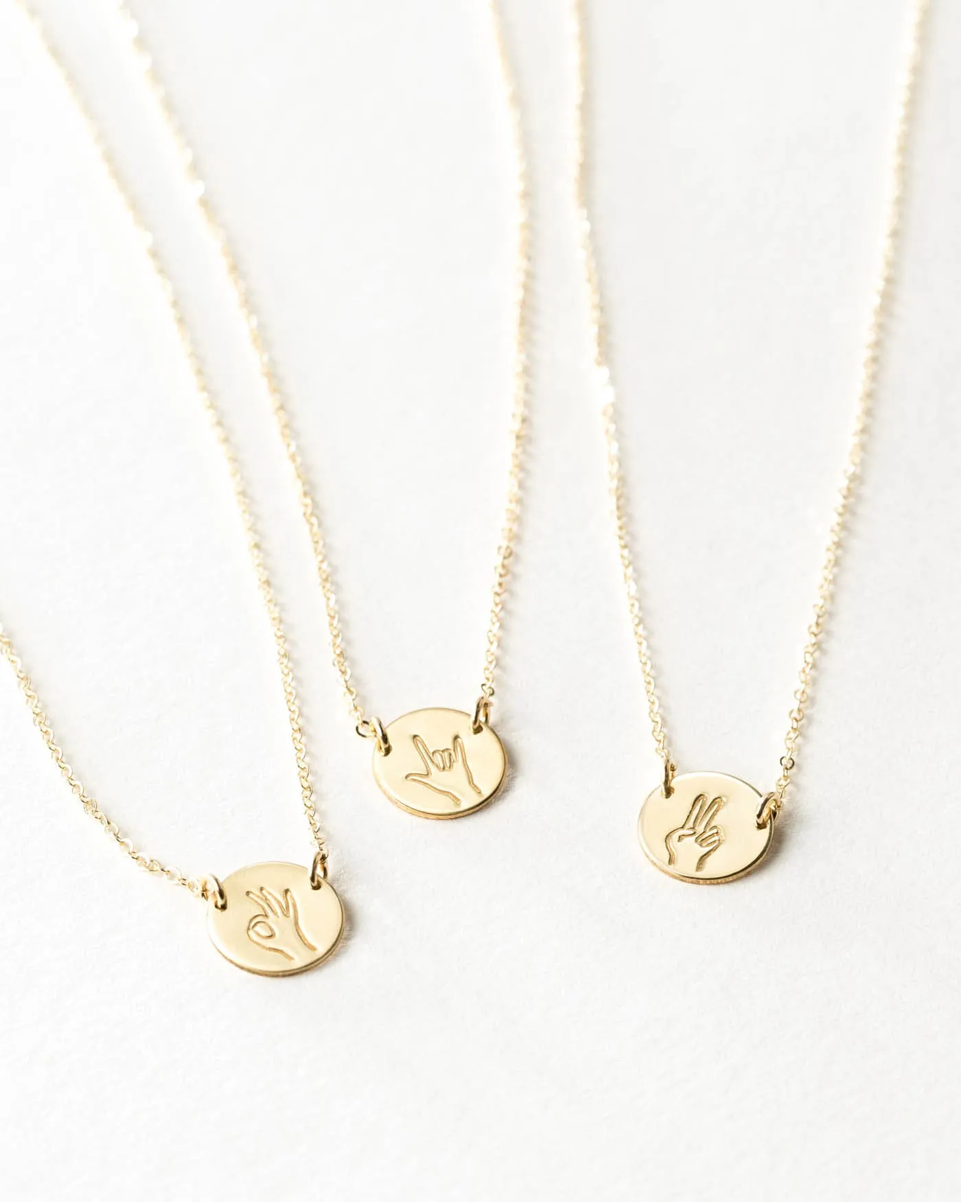 Hand Gestures Link Necklace sold by GLDN