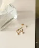 Sia Pearl Huggie Hoops sold by GLDN
