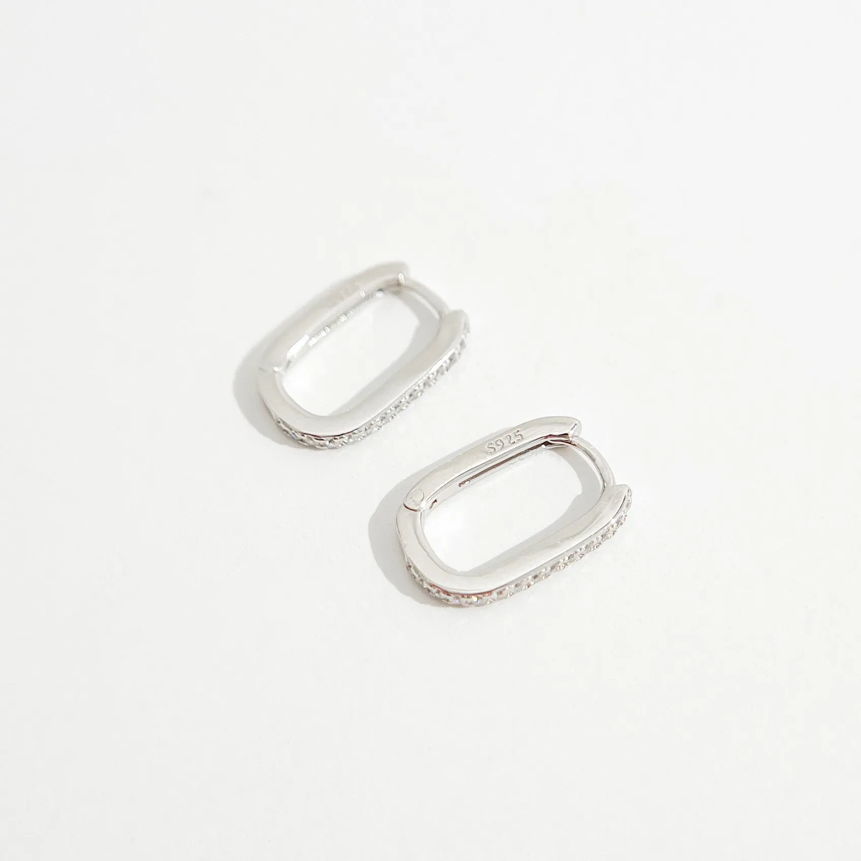 Oval Pave Huggies in Silver sold by Flaire & Co. product image thumbnail 4