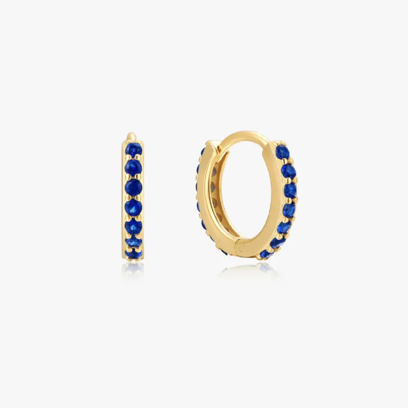 Blue Gem Huggies in Gold sold by Flaire & Co.