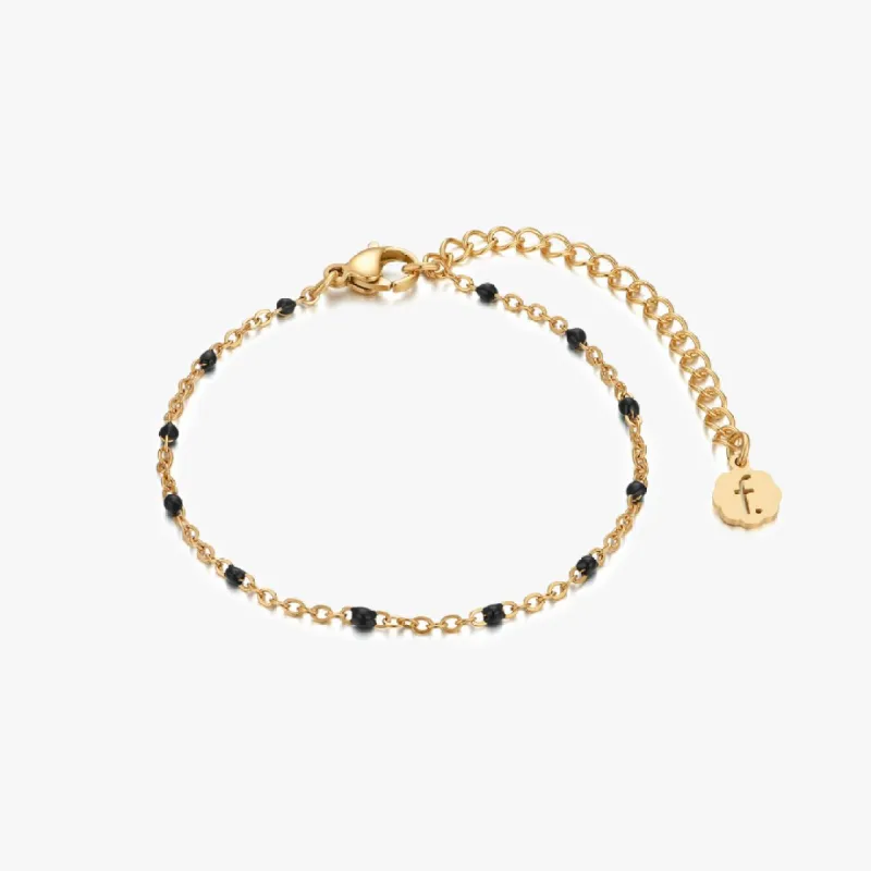 Black Enamel Beaded Bracelet in Gold sold by Flaire & Co.