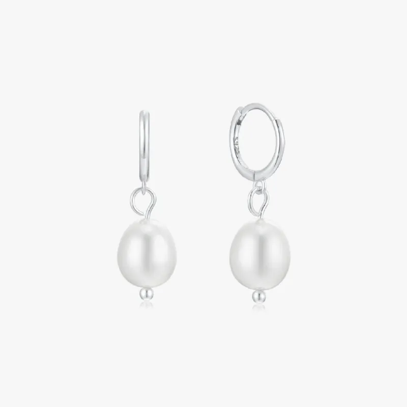 Single Pearl Sterling Huggies in Silver sold by Flaire & Co.
