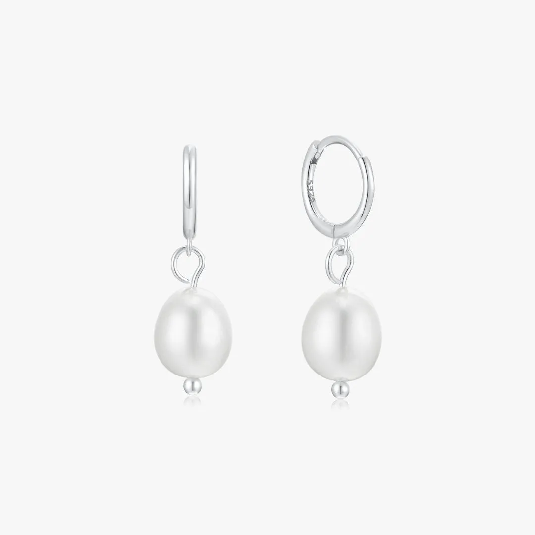 Single Pearl Sterling Huggies in Silver sold by Flaire & Co.