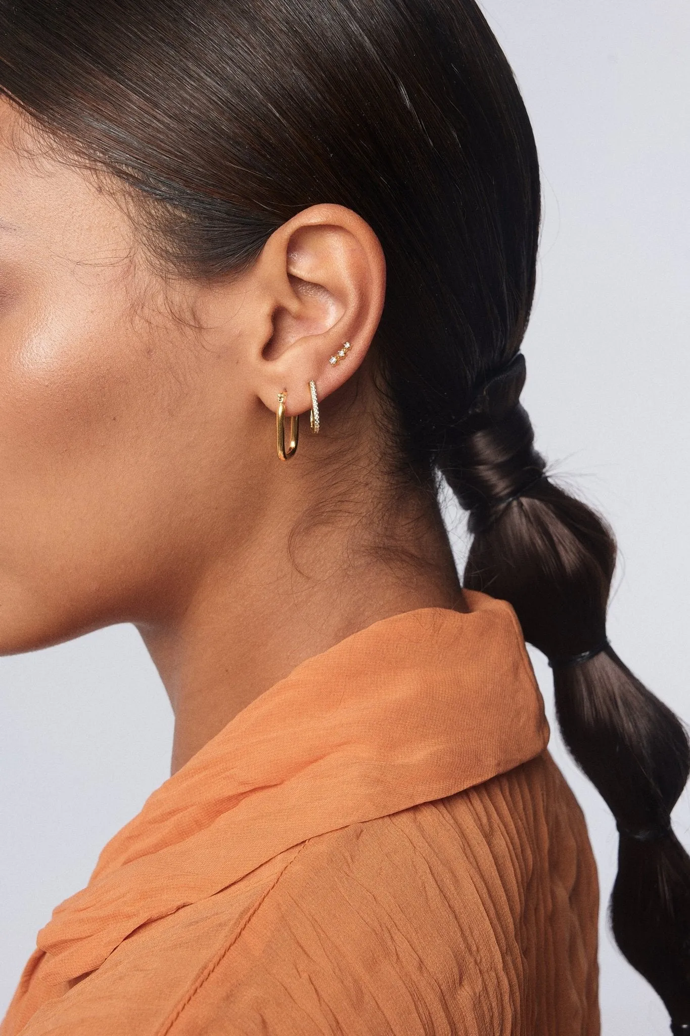 Oval Pave Huggies in Gold sold by Flaire & Co. product image thumbnail 3