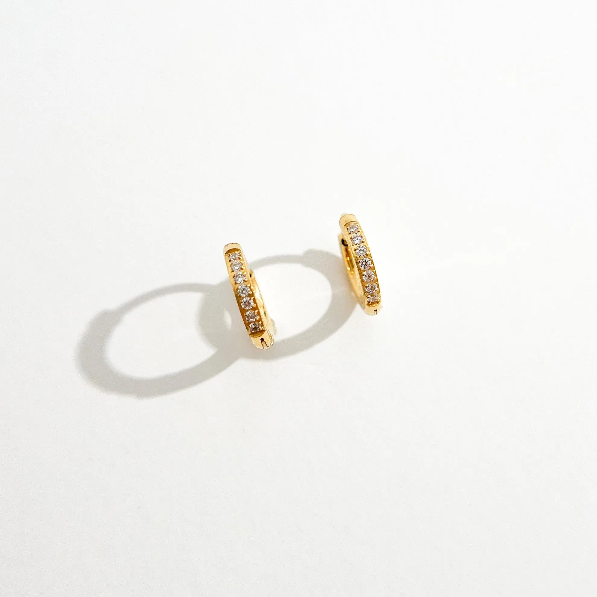 Crystal Huggie Gold Hoops sold by Flaire & Co. product image thumbnail 5
