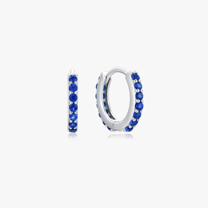 Blue Gems Huggies in Silver sold by Flaire & Co.