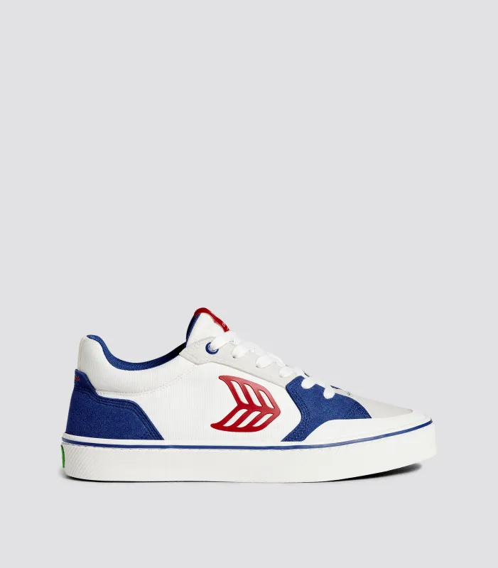 VALLELY PRO Mystery Blue Suede and Off-White Cordura Red Logo Sneaker Women sold by Cariuma