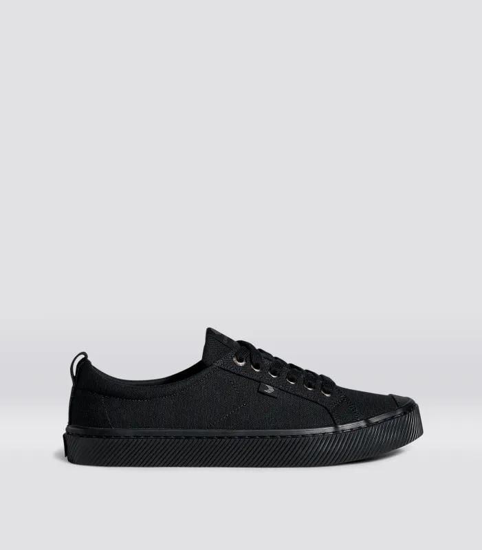 OCA Low All Black Canvas Sneaker sold by Cariuma
