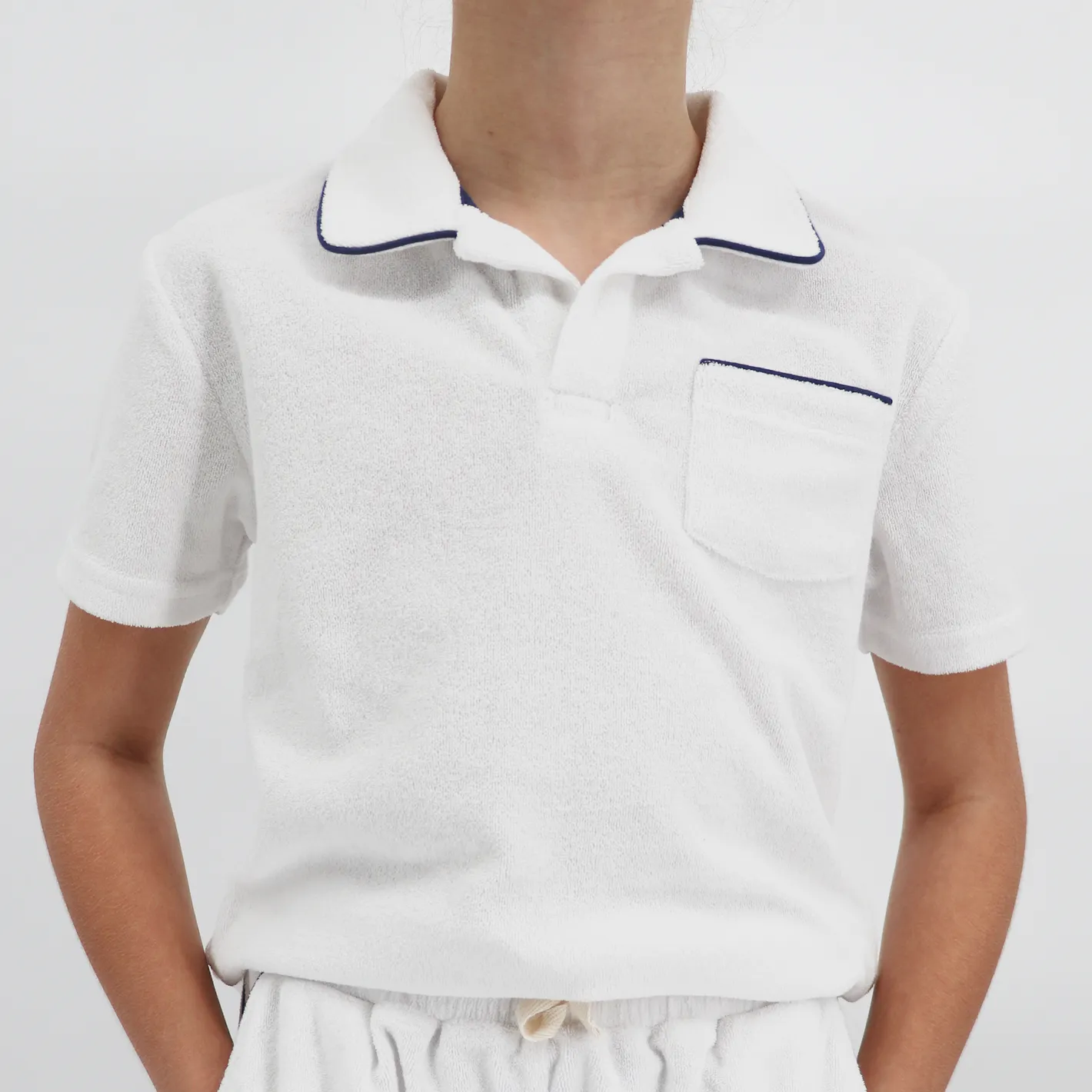 unisex white french terry polo with navy piping sold by minnow product image thumbnail 4