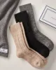 Women's Cashmere Socks in Black sold by Petite Plume