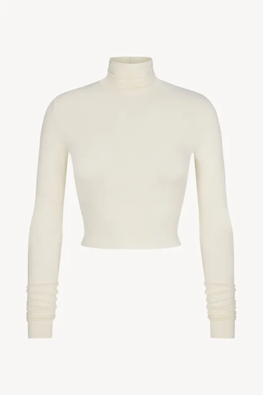 CROPPED FITTED TURTLENECK TOP sold by Eterne